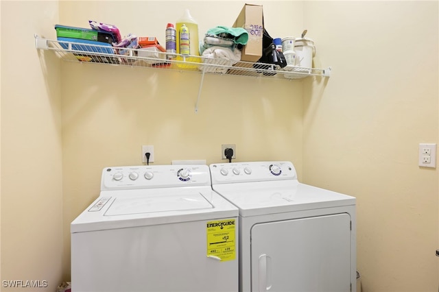 laundry area with laundry area and separate washer and dryer