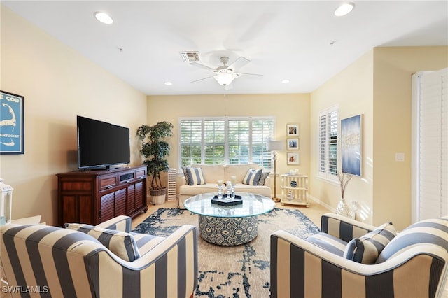 living area with ceiling fan, visible vents, baseboards, and recessed lighting