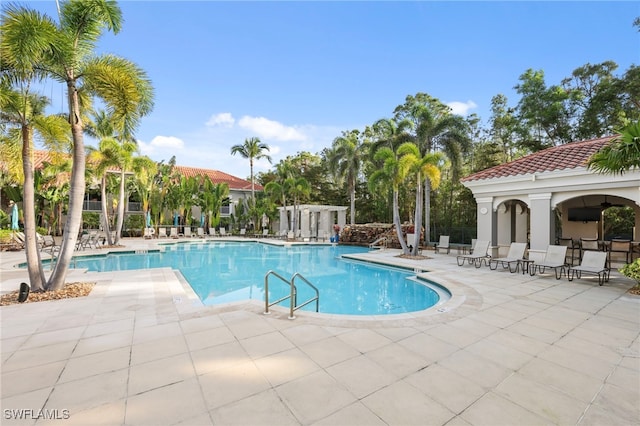 pool with a patio area