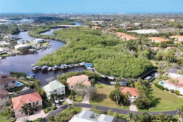 drone / aerial view featuring a water view and a residential view