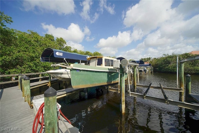 dock area featuring a water view and boat lift