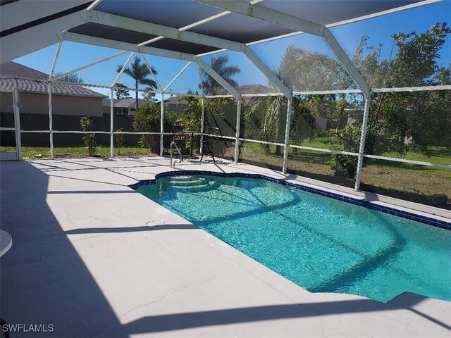 view of pool featuring a lanai and a patio