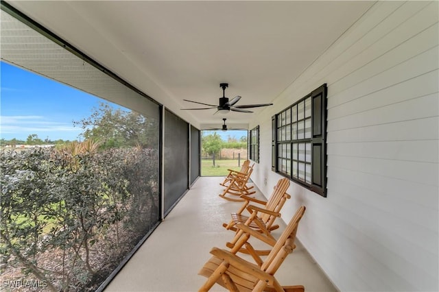 sunroom / solarium with ceiling fan