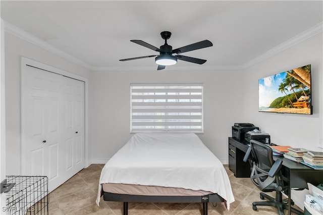 bedroom with light tile patterned floors, baseboards, ceiling fan, ornamental molding, and a closet