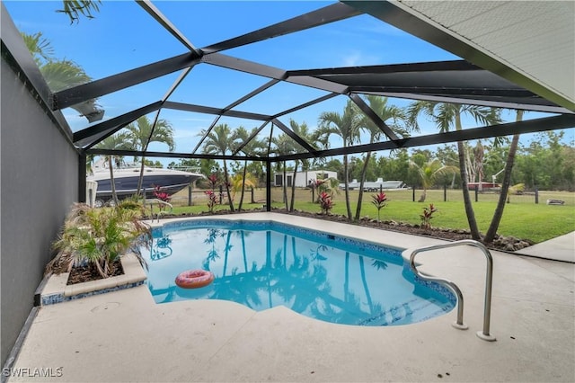 pool featuring a yard, a patio area, and a lanai