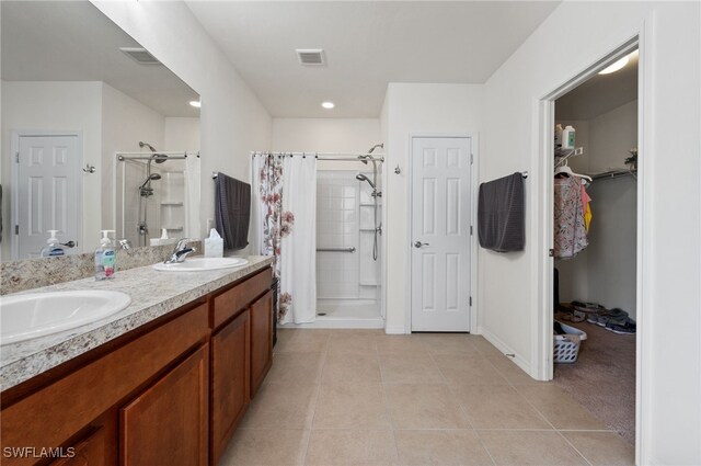 2550 Ocasa Ct, Cape Coral, FL 33909 - bathroom with visible vents, a sink, and a shower stall