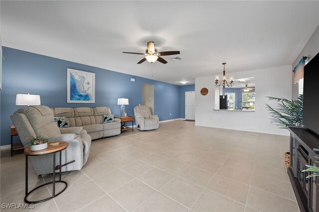 2550 Ocasa Ct, Cape Coral, FL 33909 - living area featuring visible vents, light tile patterned flooring, a ceiling fan, and baseboards