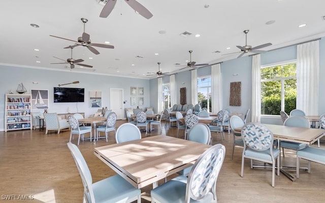 2550 Ocasa Ct, Cape Coral, FL 33909 - dining space with light wood-style floors, recessed lighting, visible vents, and crown molding