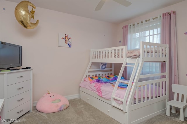 bedroom with baseboards, a ceiling fan, and light colored carpet