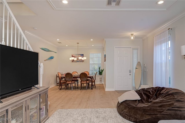 living area featuring ornamental molding, recessed lighting, visible vents, and light wood-style flooring