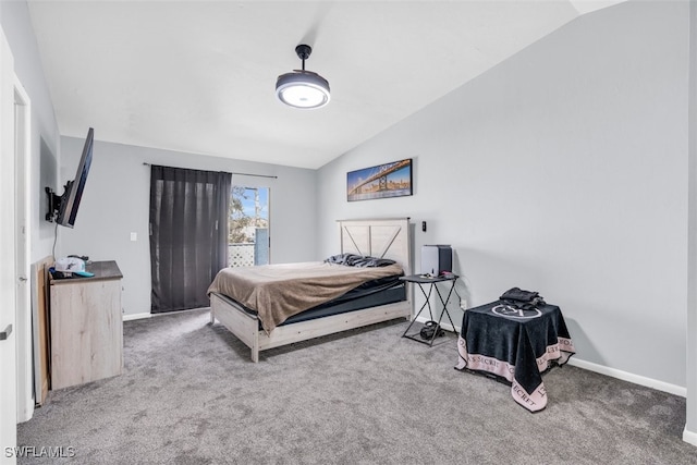 carpeted bedroom featuring lofted ceiling