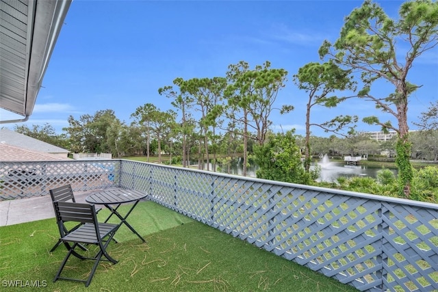 balcony featuring a water view