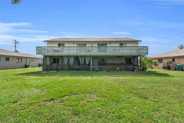 back of house with central AC and a lawn