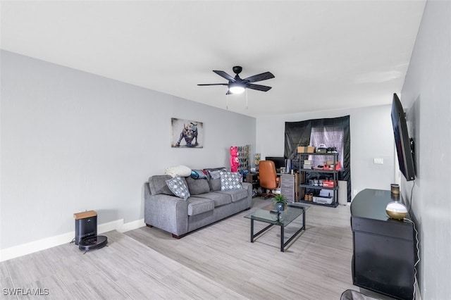 living room featuring light wood-type flooring and ceiling fan