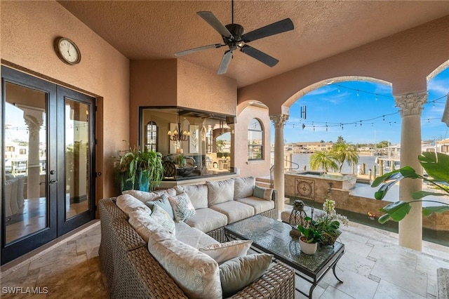 view of patio / terrace with an outdoor hangout area, ceiling fan, and french doors