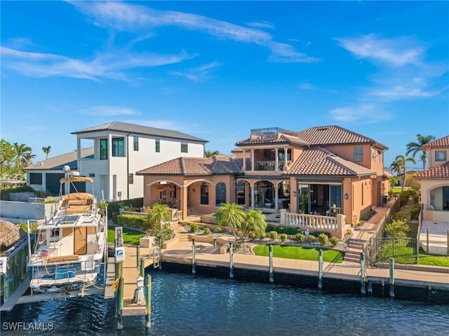 rear view of property with a water view