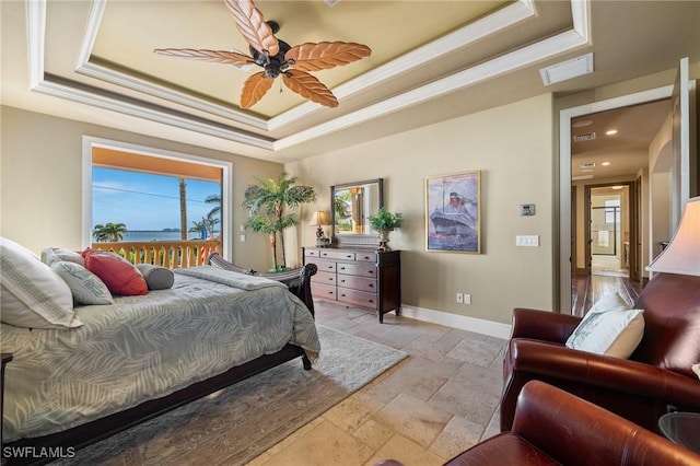 bedroom featuring ceiling fan, crown molding, and a raised ceiling