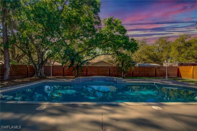 view of pool featuring a fenced in pool, a fenced backyard, and a patio area