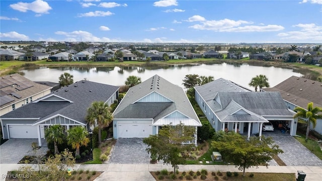 birds eye view of property featuring a residential view and a water view