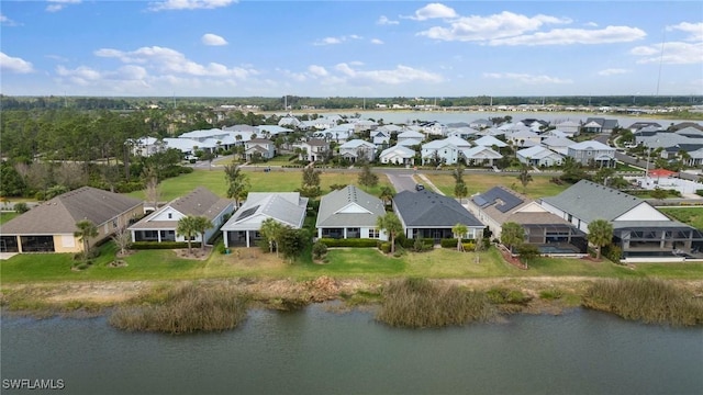 birds eye view of property with a residential view and a water view