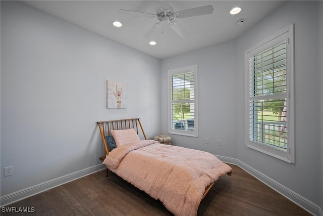 bedroom featuring ceiling fan, recessed lighting, dark wood finished floors, and baseboards