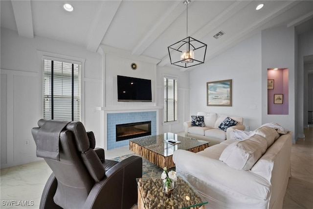 living room with lofted ceiling with beams, a healthy amount of sunlight, visible vents, and a tiled fireplace