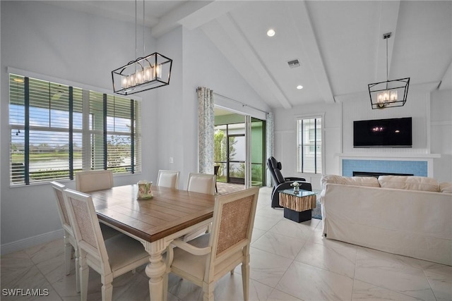 dining room featuring recessed lighting, a fireplace, baseboards, beamed ceiling, and an inviting chandelier