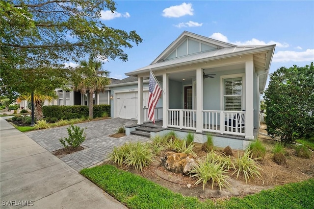 view of front of house with a garage, board and batten siding, a porch, and decorative driveway