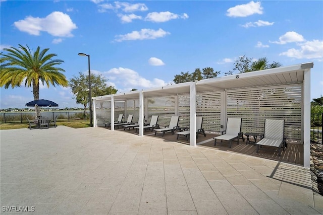 exterior space featuring fence and a pergola