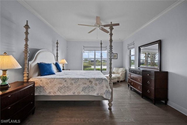 bedroom with dark wood-style floors, a ceiling fan, baseboards, and crown molding