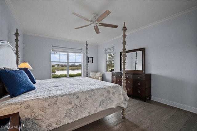 bedroom with ornamental molding, a water view, dark wood finished floors, and baseboards