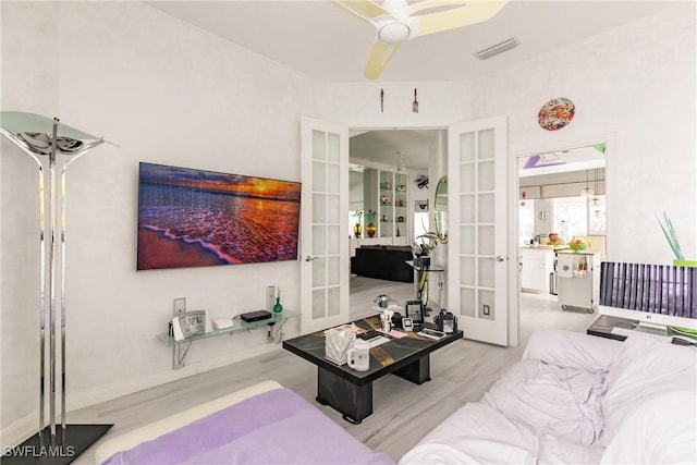 3500 Donoso Ct, Naples, FL 34109 - bedroom featuring french doors, wood finished floors, ceiling fan, and baseboards