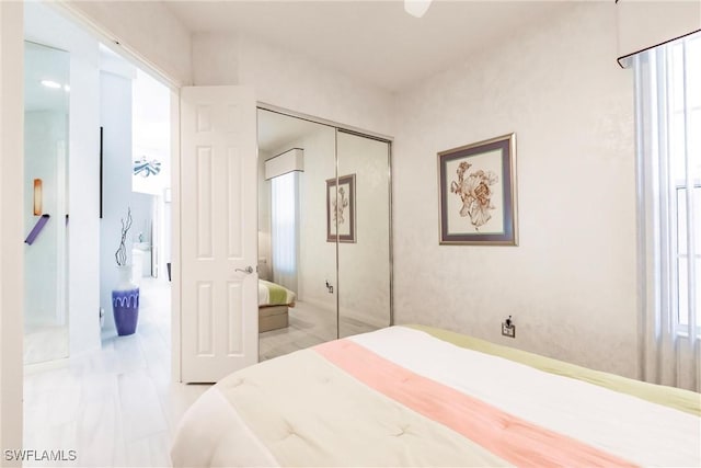 3500 Donoso Ct, Naples, FL 34109 - bedroom with multiple windows and a closet