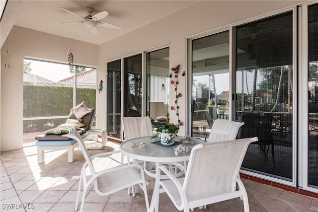 sunroom / solarium with ceiling fan