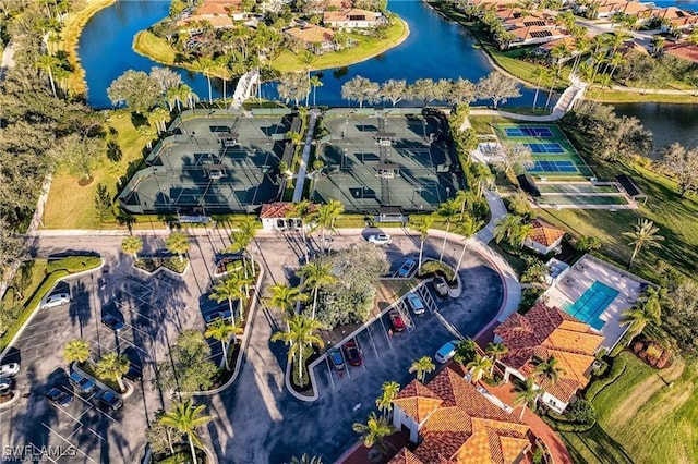 birds eye view of property with a water view