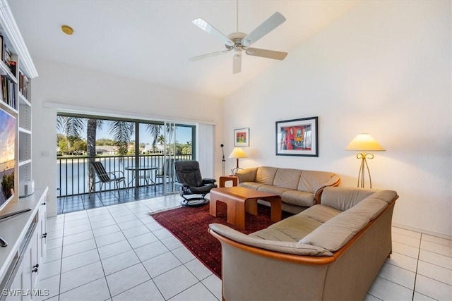 1090 Partridge Cir Unit 201, Naples, FL 34104 - tiled living room with high vaulted ceiling and ceiling fan