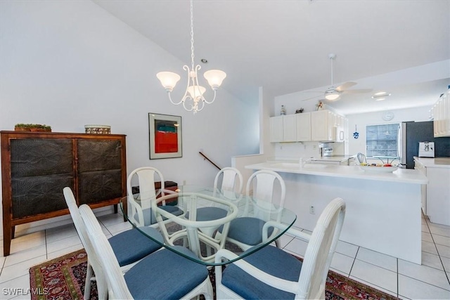 1090 Partridge Cir Unit 201, Naples, FL 34104 - dining space featuring ceiling fan with notable chandelier, light tile patterned floors, and lofted ceiling