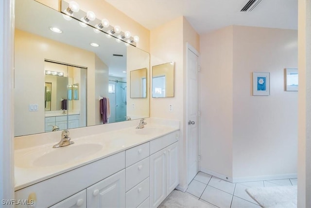 1090 Partridge Cir Unit 201, Naples, FL 34104 - bathroom featuring a shower, tile patterned floors, and vanity