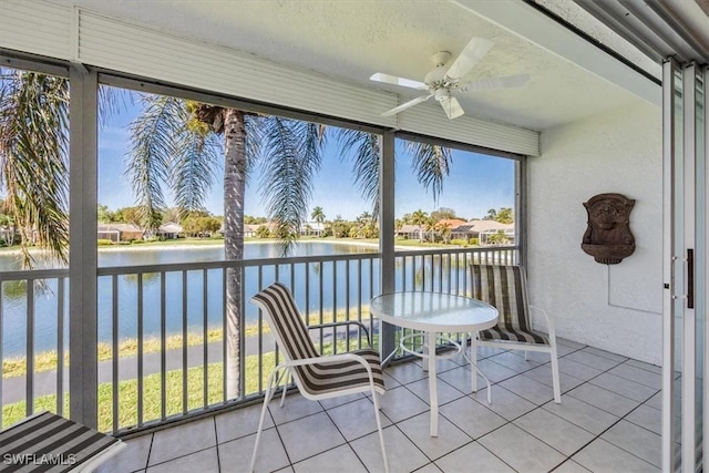 1090 Partridge Cir Unit 201, Naples, FL 34104 - sunroom featuring a water view and ceiling fan