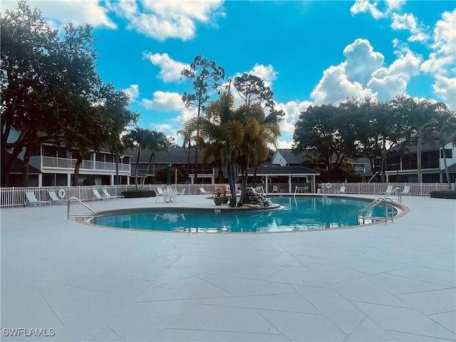 1090 Partridge Cir Unit 201, Naples, FL 34104 - view of swimming pool with a patio area