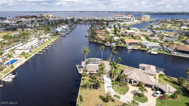 drone / aerial view with a residential view and a water view