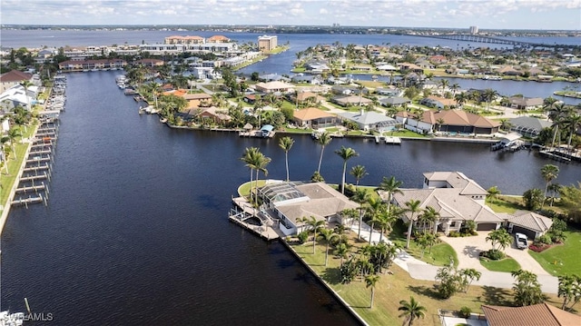 bird's eye view featuring a water view and a residential view