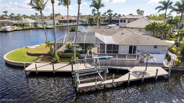 dock area with glass enclosure, boat lift, a water view, a residential view, and a swimming pool