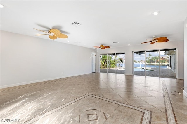 unfurnished room featuring recessed lighting, visible vents, ceiling fan, and baseboards