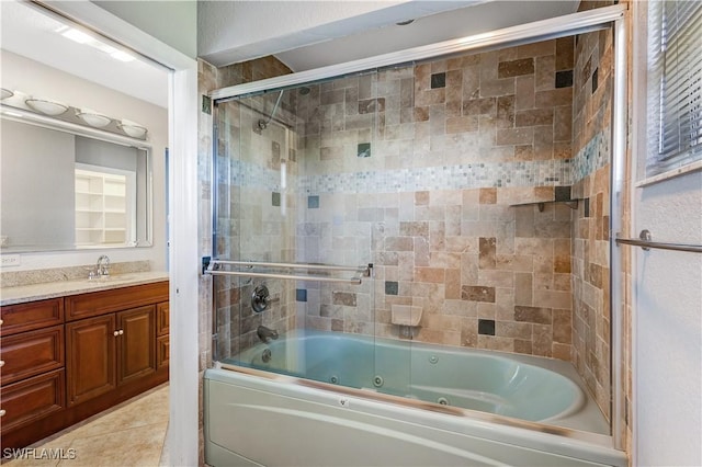 full bathroom featuring tile patterned flooring, a combined bath / shower with jetted tub, and vanity