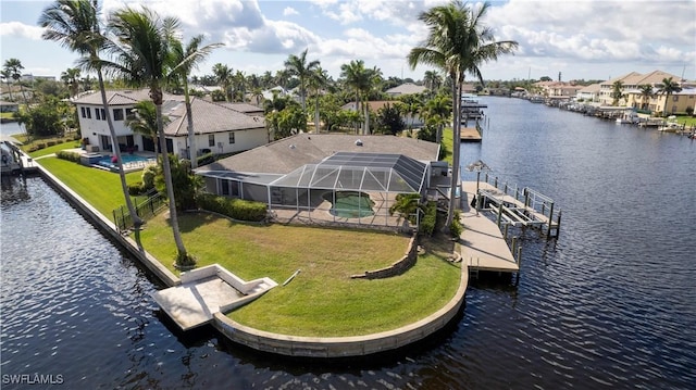 drone / aerial view with a residential view and a water view