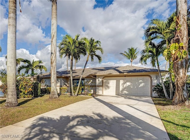 ranch-style house with a garage, driveway, a front lawn, and stucco siding