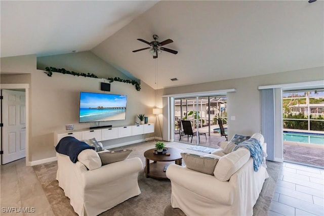 tiled living room with lofted ceiling and ceiling fan