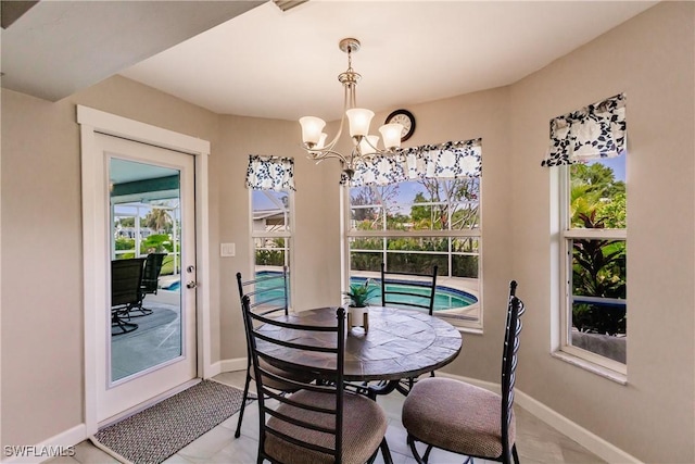 dining space with a notable chandelier