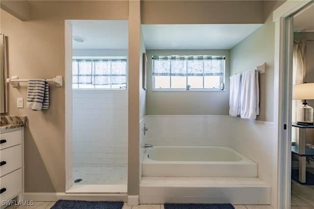 bathroom with plus walk in shower and vanity